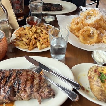 Bare Bones Steakhouse - L-R ...Signature mule, fries, NY steak, onion rings, , loaded baked potato & best prime rib eye. - Steakhouses Near Me - Buford, Georgia Bare Bones Steakhouse - L-R ...Signature mule, fries, NY steak, onion rings, , loaded baked potato & best prime rib eye. - Steakhouses Near Me - Buford, Georgia