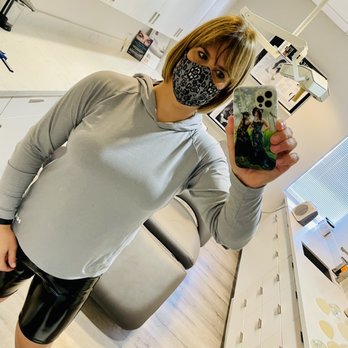 Aesthetx - Trying on sizers, 350cc my on right side, 305cc on my left side. I selected 305cc, round, mod + profile by Sientra. - Cosmetic Surgeons Near Me - Campbell, California