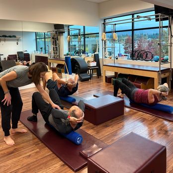 Moving Spirit - Pilates Teacher Sarah Moore cueing a client's form during a Core Essentials Pilates mat class. - Pilates Near Me - North Vancouver, British Columbia Moving Spirit - Pilates Teacher Sarah Moore cueing a client's form during a Core Essentials Pilates mat class. - Pilates Near Me - North Vancouver, British Columbia