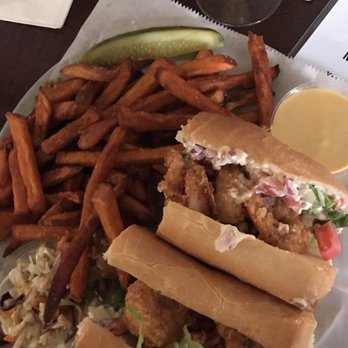 Copper Penny - Shrimp po boy with sweet potato fries and a small cup of cole slaw. Zero complaints here! - American Near Me - Wilmington, North Carolina