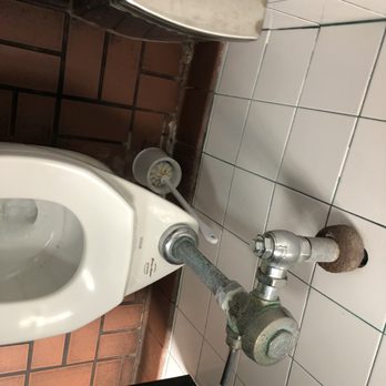 Beef 'O' Brady's - Difficult to eat after using this rest room.  They really need to update their cleanliness program. - Pubs Near Me - Clermont, Florida