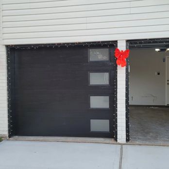 JE Complete - Flush black door - Garage Door Services Near Me - Conroe, Texas JE Complete - Flush black door - Garage Door Services Near Me - Conroe, Texas