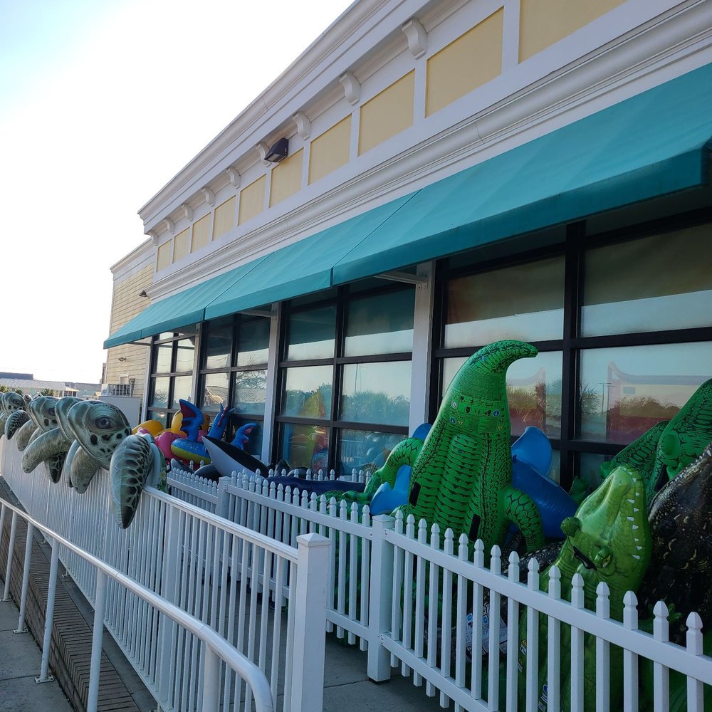 Dollar General - a row of fake alligators in front of a store - Discount Store Near Me - Gulf Shores, Alabama Dollar General - a row of fake alligators in front of a store - Discount Store Near Me - Gulf Shores, Alabama