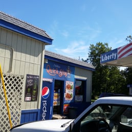 a truck parked in front of a store a truck parked in front of a store