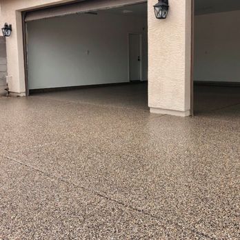 StoneCoat Floors - a garage with a large garage door - Flooring Near Me StoneCoat Floors - a garage with a large garage door - Flooring Near Me