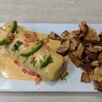 Noble Restaurant - Breakfast Burrito with redskin potatoes. Chipotle hollandaise sauce on top. - Breakfast & Brunch Near Me - Wyoming, Michigan Noble Restaurant - Breakfast Burrito with redskin potatoes. Chipotle hollandaise sauce on top. - Breakfast & Brunch Near Me - Wyoming, Michigan