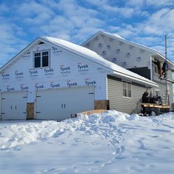 J Hempel Services - Our team installing new vinyl siding.