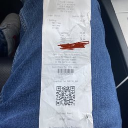a receipt with a blood stain on it