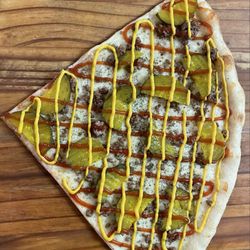 Byron place - Cheeseburger pizza  yellow mustard ketchup grand beef and pickles