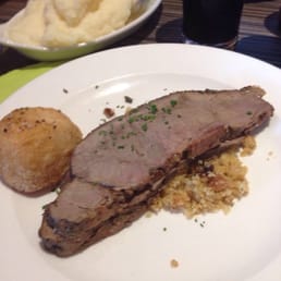 Roast beef in breadcrumb stuffing and a deep fried potato.