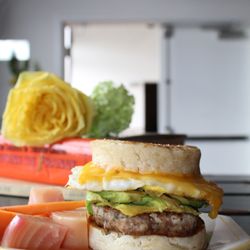 Madam Zola's Fortune - Egg and cheese breakfast sandwich, with sausage and avocado.