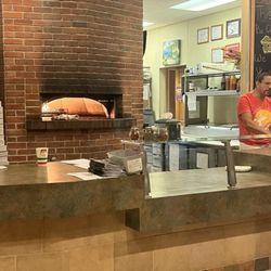 DeNunzio's Brick Oven Pizza & Grille - Mr. DeNunzio's brick oven.  Fired up super hot fur that perfectly crispy, chewy pizza crust.
