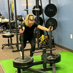 Grand Oaks Sports Medicine and Rehabilitation - Runner working out on weighted sled