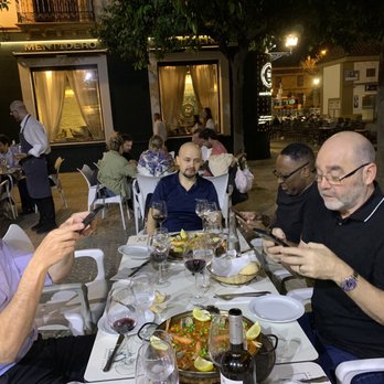 Modesto - Part of our group taking a few pictures of the paella to make family members jealous back home! - Spanish Near Me - Seville, SE