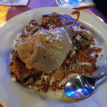 Pat O'Brien's - Really huge bread pudding. Very good but best for two or more. - Bars Near Me - Orlando, Florida Pat O'Brien's - Really huge bread pudding. Very good but best for two or more. - Bars Near Me - Orlando, Florida