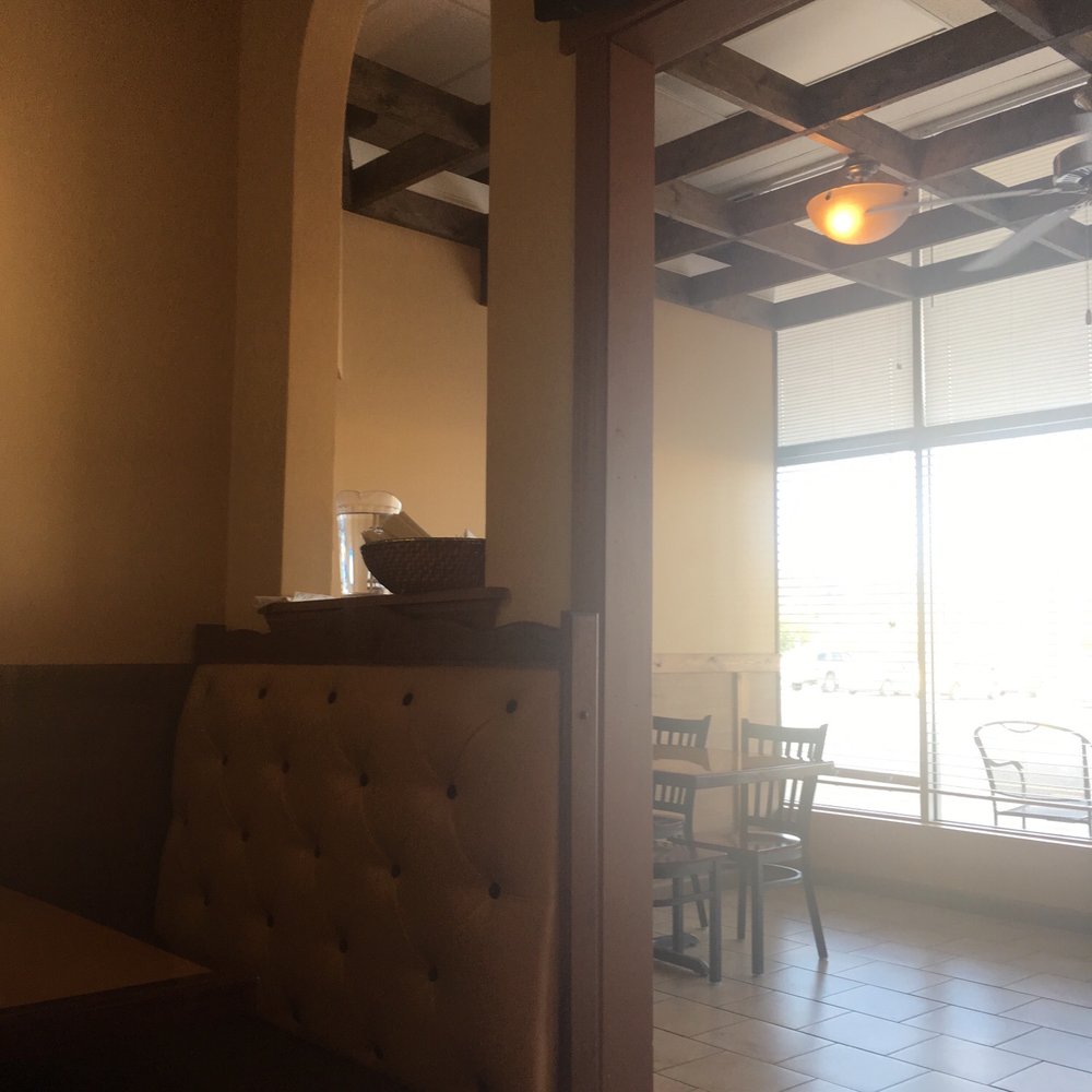 a view of a dining room with a television a view of a dining room with a television
