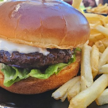 Lagoon Grill - American Kobe burger with fries. 23 bucks. Cooked medium. Fresh brioche bun was buttered and lightly toasted. Pretty good burger. - American Near Me - Waikoloa, Hawaii