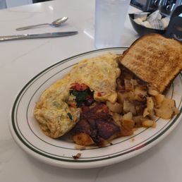 Veggie omelet, hash browns, sour dough toast