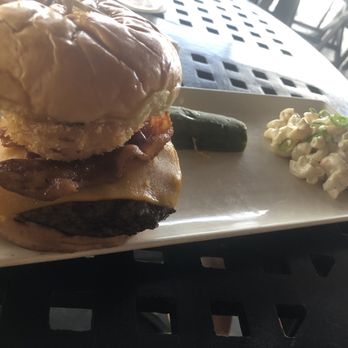 Kona Brewing - Paniolo burger. $16.50. Pretty good burger, decent Mac salad, gross pickle. - Pubs Near Me - Honolulu, Hawaii Kona Brewing - Paniolo burger. $16.50. Pretty good burger, decent Mac salad, gross pickle. - Pubs Near Me - Honolulu, Hawaii
