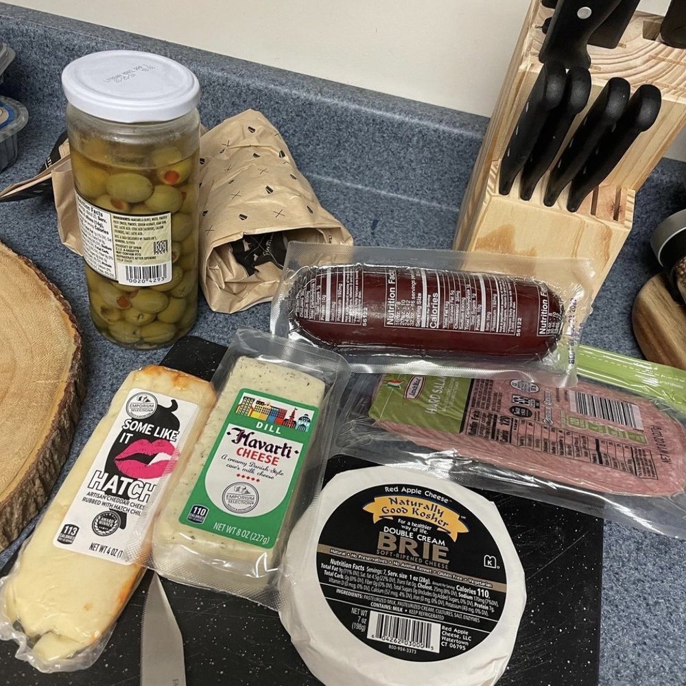 ALDI - cheese, olives, bread, and other foods on a counter - Grocery Near Me - Forest Hills, Pennsylvania