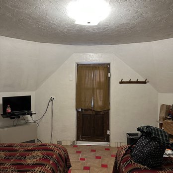 Wigwam Motel - Inside of double bed wigwam, taken from bathroom doorway - Hotels Near Me - Holbrook, Arizona Wigwam Motel - Inside of double bed wigwam, taken from bathroom doorway - Hotels Near Me - Holbrook, Arizona