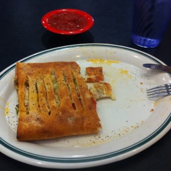 New York Pizza - Half of a combination Stromboli (mushrooms, sausage, pepperoni and green pepper). - Italian Near Me - Irving, Texas New York Pizza - Half of a combination Stromboli (mushrooms, sausage, pepperoni and green pepper). - Italian Near Me - Irving, Texas