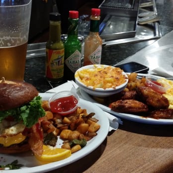 Trident Grill II - Breakfast burger with potatoes, wings, mac and cheese and eggs. Burgers are so good! - Seafood Near Me - Tucson, Arizona Trident Grill II - Breakfast burger with potatoes, wings, mac and cheese and eggs. Burgers are so good! - Seafood Near Me - Tucson, Arizona
