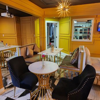 Sior ATL - a living room with yellow walls - New American Near Me - Atlanta, Georgia