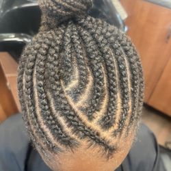 Cornrows out in a bun