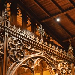Ornately carved rood screen separating the chancel from the nave.