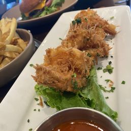 Happy hour menu items : coconut  shrimp  , Double Cheeseburger  , side of fries