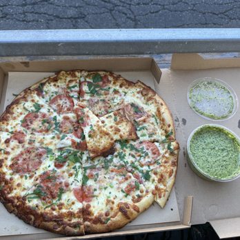 Cheese Board Pizza - Roma Tomato, garlic & oregano pizza with Cilantro-garlic sauce. - Pizza Near Me - Berkeley, California Cheese Board Pizza - Roma Tomato, garlic & oregano pizza with Cilantro-garlic sauce. - Pizza Near Me - Berkeley, California