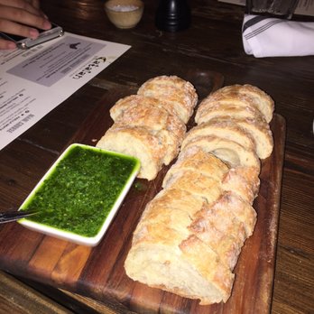 Catalan - Yummy bread and chimichurri sauce. - Mediterranean Near Me - Rancho Mirage, California Catalan - Yummy bread and chimichurri sauce. - Mediterranean Near Me - Rancho Mirage, California