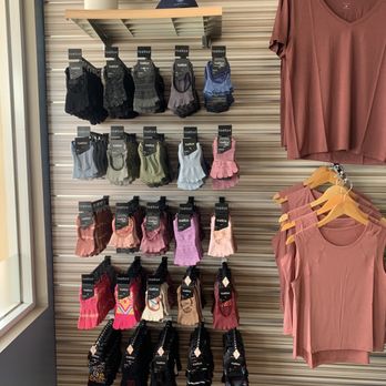 Club Pilates - Toe sock wall! Took home a pair of the bright blues (not pictured here) and a pair of the pink ones with hearts. Size small 5-7. - Pilates Near Me - Fullerton, California
