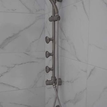 Lazaros Construction & Remodeling - a shower head and hand shower - General Contractors Near Me Lazaros Construction & Remodeling - a shower head and hand shower - General Contractors Near Me
