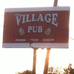 The Village Pub - Sign out front.