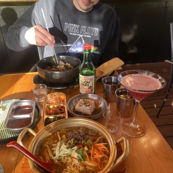 Tiger Mama - Bibimbap far dish. K-ramen with added beef bulgogi front dish. Black pink drink on the side. They have a variety of soju. Banchan included. - Korean Near Me - Eugene, Oregon Tiger Mama - Bibimbap far dish. K-ramen with added beef bulgogi front dish. Black pink drink on the side. They have a variety of soju. Banchan included. - Korean Near Me - Eugene, Oregon