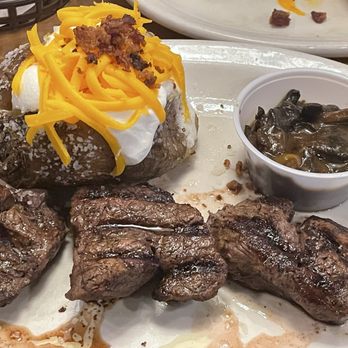 Texas Roadhouse - Filet Medallions* with mushroom sauce and loaded baked potato - Steakhouses Near Me - Greensburg, Pennsylvania Texas Roadhouse - Filet Medallions* with mushroom sauce and loaded baked potato - Steakhouses Near Me - Greensburg, Pennsylvania