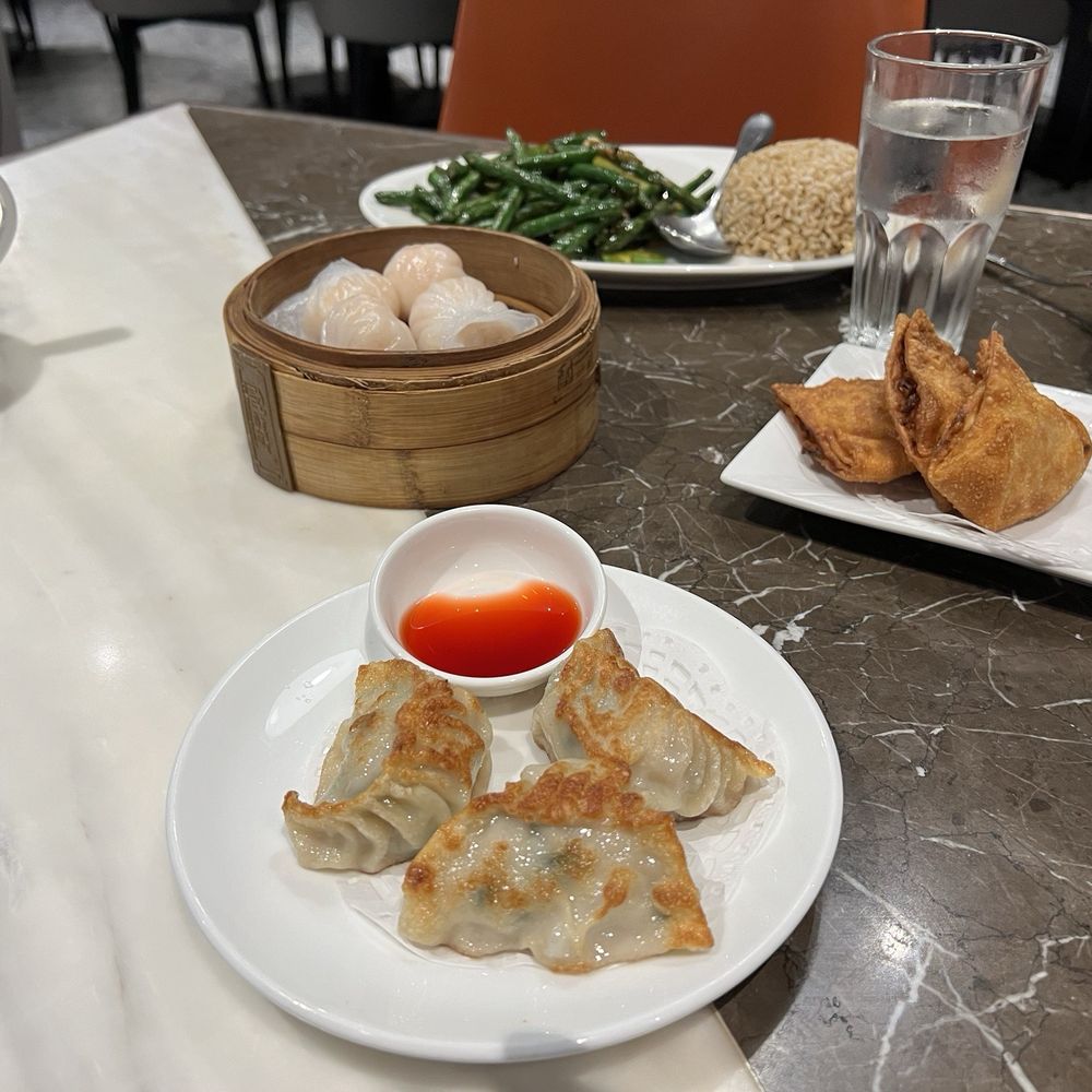 Chicken and Pork Gyoza, MingHin Shrimp Dumpling, Crab Rangoon (4), and Stir-Fried String Beans on Rice