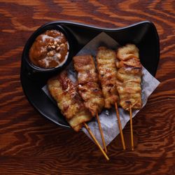 Marinated chicken on a stick with house made peanut sauce