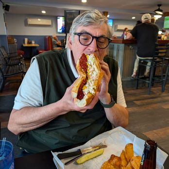 Greg's Cabana Bar & Grill - Eating an all beef, half- pound, footlong hotdog in one sitting. - Bars Near Me - Murrells Inlet, South Carolina Greg's Cabana Bar & Grill - Eating an all beef, half- pound, footlong hotdog in one sitting. - Bars Near Me - Murrells Inlet, South Carolina