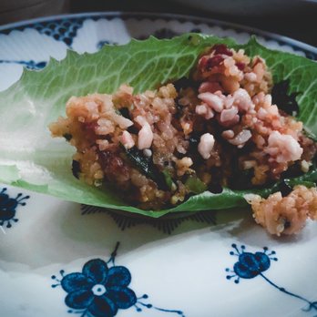 Bida Manda - Crispy Rice Lettuce Wrap appetizer prepared (scoop rice into lettuce leaf and top with chili sauce) - Laotian Near Me - Raleigh, North Carolina