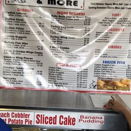 a woman ordering a slice of cake a woman ordering a slice of cake