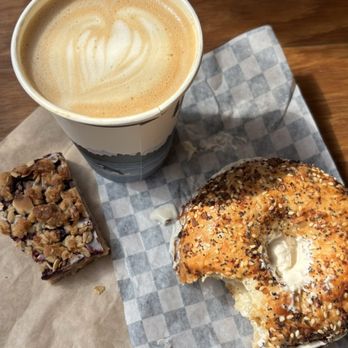 Irwin's Bakery and Cafe - Latte with almond milk, everything bagel with vegan cream cheese, and a vegan blackberry bar of some kind - Bakeries Near Me - Seattle, Washington