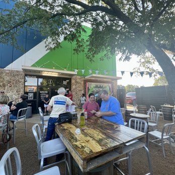 Hop and Sting Brewing Company - The patio beer garden eating breakfast tacos - Breweries Near Me - Grapevine, Texas