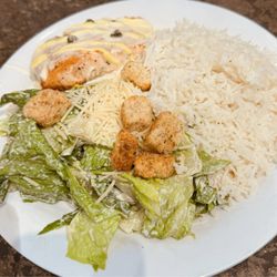 Seafood Shack - Salmon prepared with lemon caper sauce with a side of Caesar salad and basmati rice
