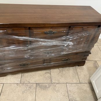 Geaux Geaux Moving - Dresser wrapped so drawers aren't loose. - Movers Near Me Geaux Geaux Moving - Dresser wrapped so drawers aren't loose. - Movers Near Me