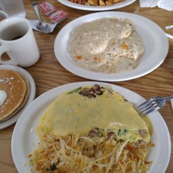 Lansing Road Omelette, with has browns, side of half order of biscuits & sausage gravy, a peak at pancakes.
