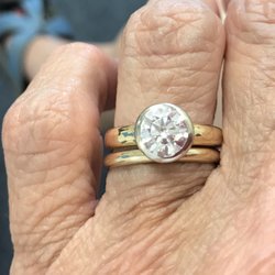 C K Jewelers - Bezel set this stone onto my father's wedding band without damaging the engraving on the inside.