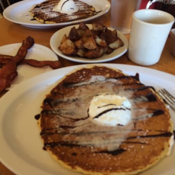 Monkey Business Cafe - Chocolate Chip Pancakes split between two plates - Sandwiches Near Me - Fullerton, California Monkey Business Cafe - Chocolate Chip Pancakes split between two plates - Sandwiches Near Me - Fullerton, California